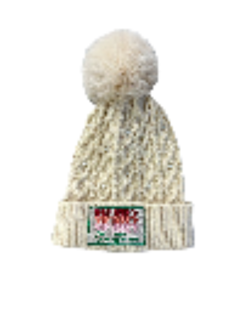 A beige fur pom-pom beanie with a 'Merry Christmas' label and pearl embellishments.